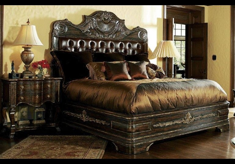High end master bedroom set. Carvings and tufted leather headboard .