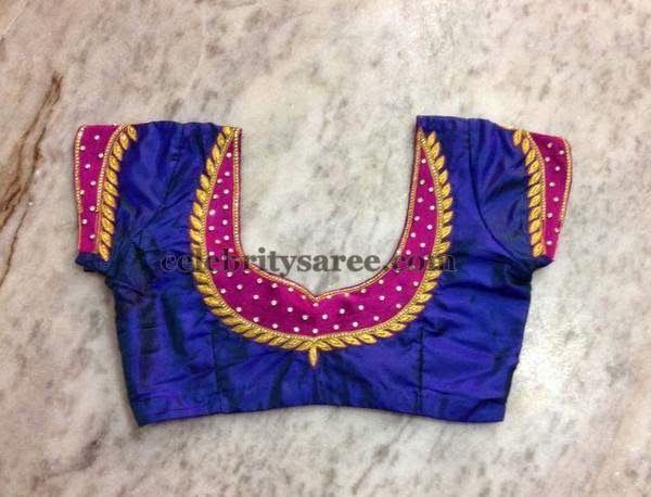Blue color raw silk designer blouse with fuchsia pink color patch .