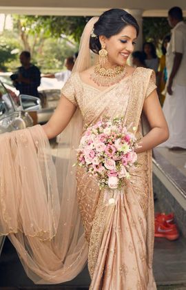 Pretty ivory bridal saree with veil | Kochi weddings | Joseph .