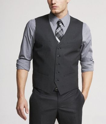 The groomsmen - charcoal pants and vests with a grey shirt (rolled .