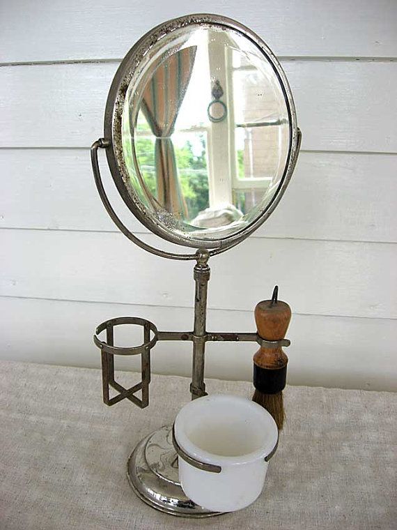 A vintage 1920s 15 inch high double sided shaving mirror and stand .