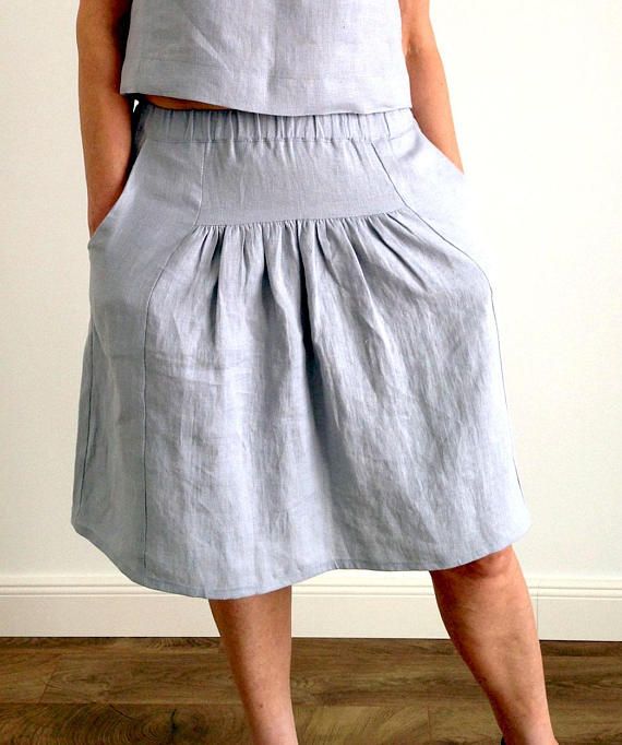 Linen loose midi summer skirt with wide elastic waist pockets .