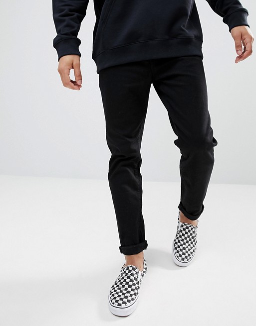 ASOS DESIGN tapered jeans in black | AS