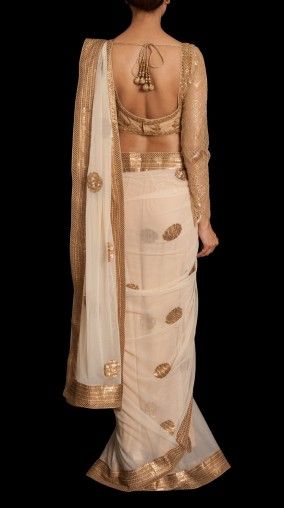 Pretty white and gold saree or sari with blouse. #IndianFashion .