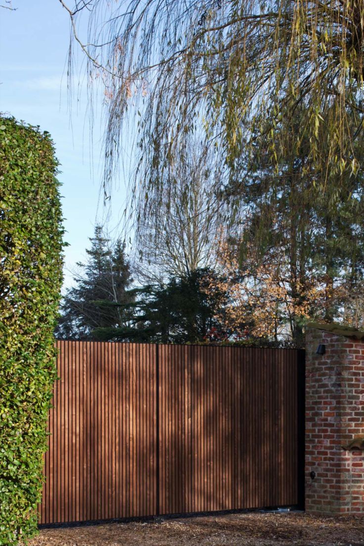 Welcome Home: 10 Inviting Wooden Gate Designs