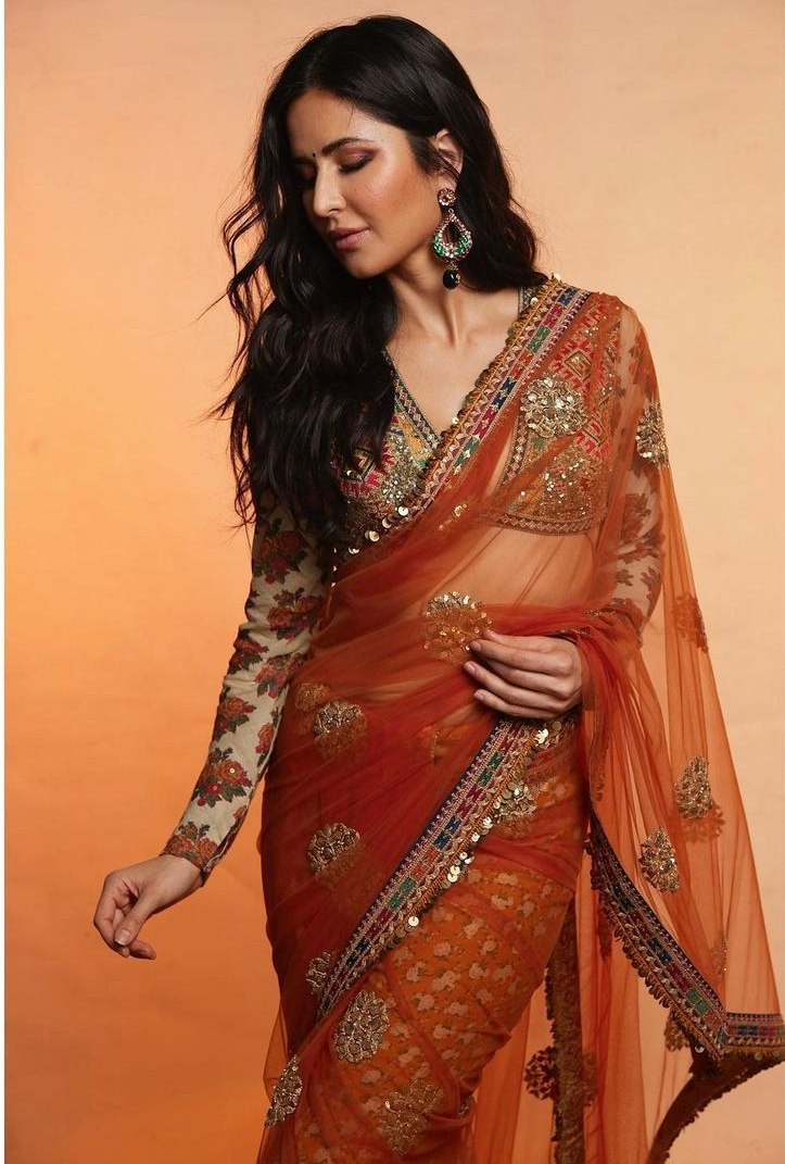 Embrace Ethnic Elegance with Orange Sarees: Vibrant and Timeless