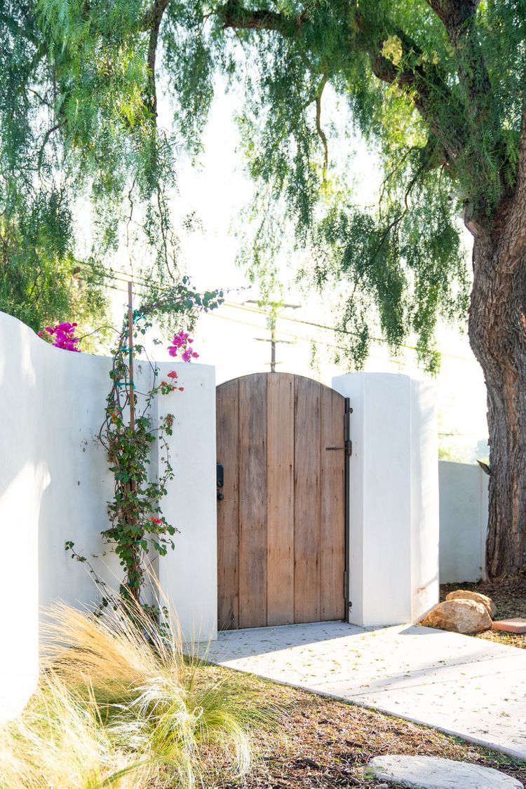 Welcome Guests in Style with Intricate Wooden Gate Designs