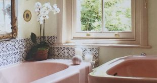 Pink bathroom suite with blue & white tiles from @houseandgardenuk .