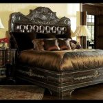 High end master bedroom set. Carvings and tufted leather headboard .