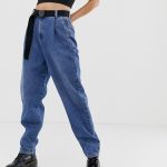 ASOS DESIGN tapered leg boyfriend jeans with curve seam in mid .