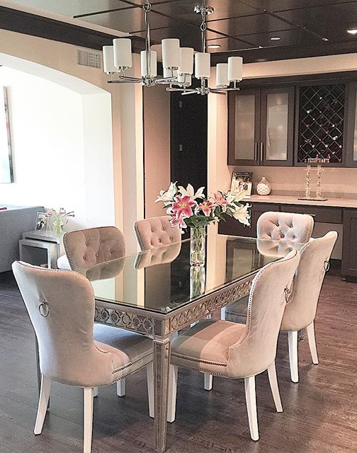 Our Sophie Mirrored Dining Table elegantly reflects its .