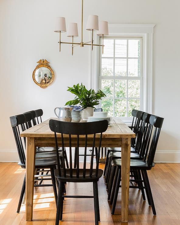 Chic cottage dining room features a farmhouse dining table lined .