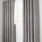 These grey curtains are thick, perfect for blocking the sun out .
