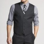 The groomsmen - charcoal pants and vests with a grey shirt (rolled .