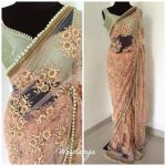 Baby Pink Mono Net Heavy Embroidery Saree with Pearl Border .