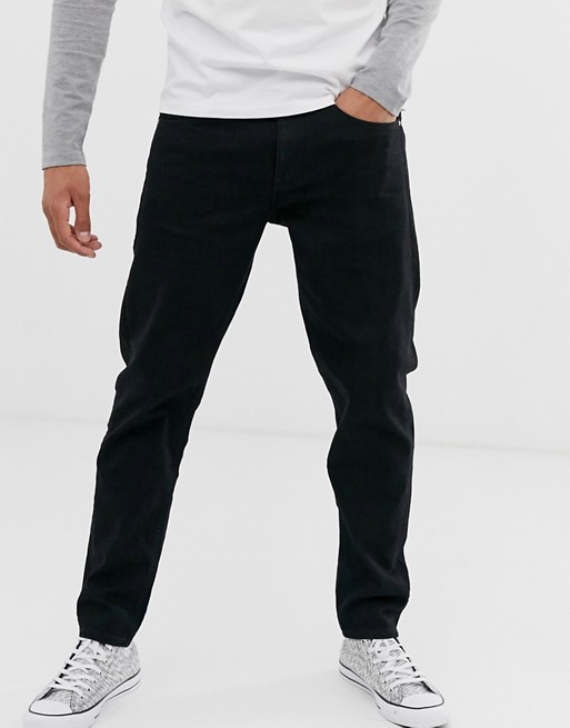 ASOS DESIGN stretch tapered jeans in black | AS