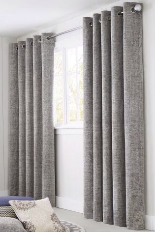 These grey curtains are thick, perfect for blocking the sun out .