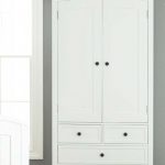 White wardrobe with drawers giving an elegant look .