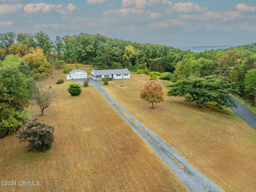 Danville’s Hidden Oasis: 5.26 Acres with Ranch Home, Garage, and Pole Barn