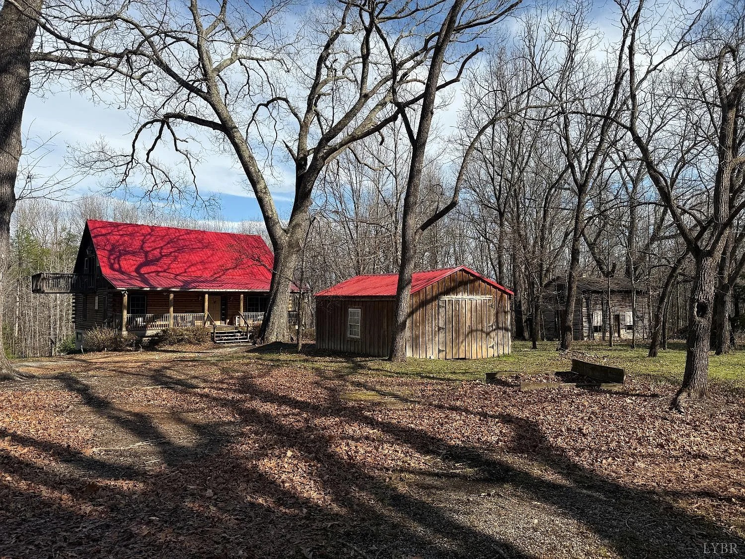 “Spacious 4-Bedroom Log Cabin on Nearly 100 Acres for Sale in Pamplin, Virginia”