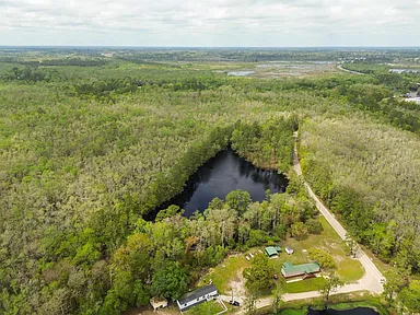 Tranquil 32-Acre Lakefront Retreat: A Nature Lover’s Paradise Minutes from Downtown