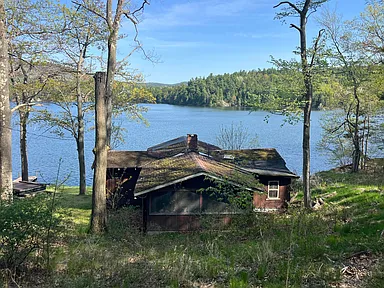 Stunning Cabin on Augur Lake – 100 Ft Waterfront with Private Dock & Boat Launch – $199,900