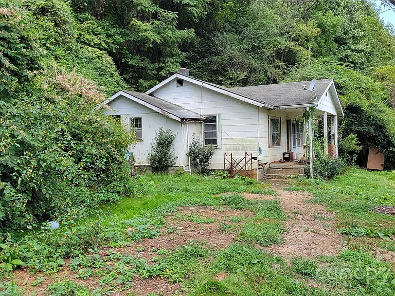 Secluded 14-Acre Riverfront Property with Unlimited Potential – Sold As Is