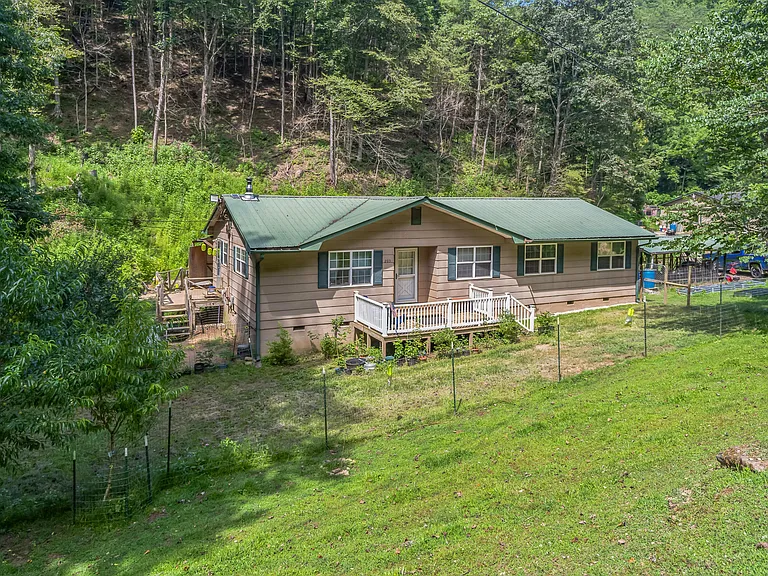 Charming 4-Bedroom Country Home on 39.45 Acres with Creek, Orchard & More – $200,000