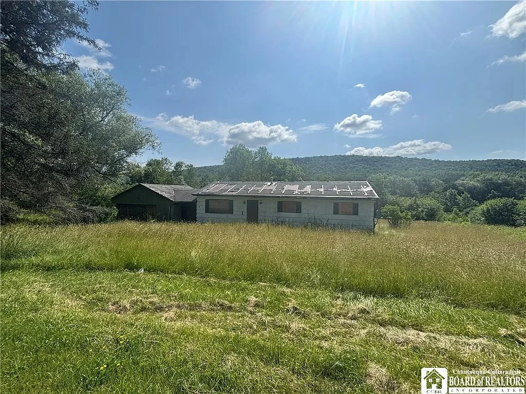 Charming Ranch Fixer-Upper on 25 Acres with Trout Stream – Scio, NY