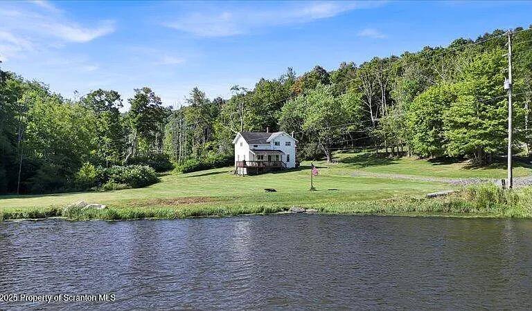 Charming Farmhouse Retreat with Creek, Pond, and Wooded Acreage