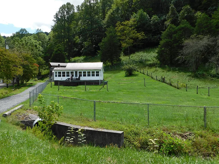 Charming Farmhouse on Over 7 Acres in a Beautiful Setting – $94,900