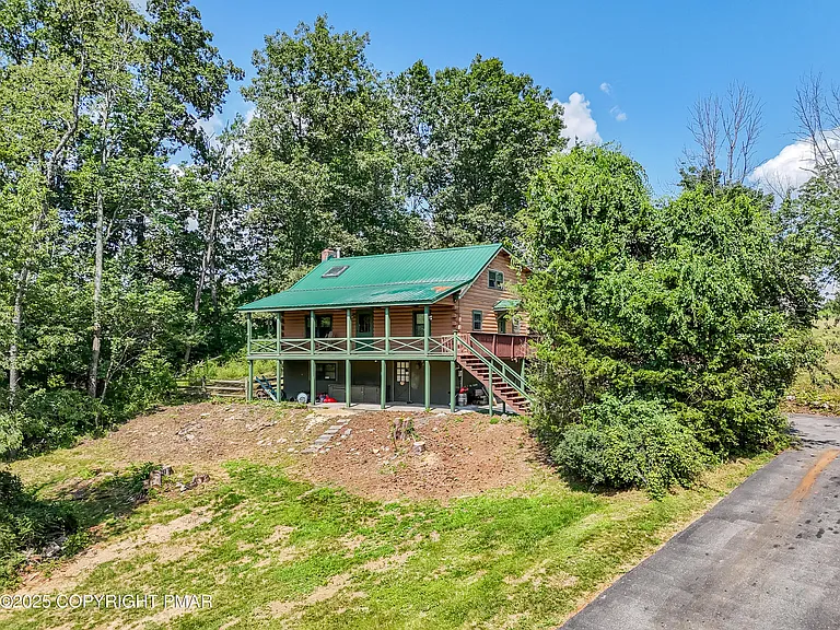 Rustic 3-Bedroom Log Home on 1.37 Acres in Sciota, PA