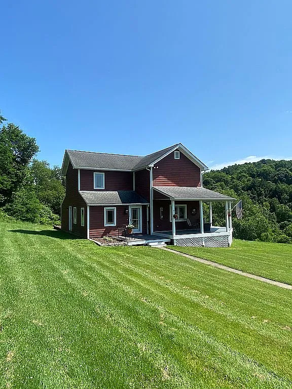 Peaceful Renovated Farmhouse on 100± Acres with Creek, Wraparound Porch & Modern Amenities