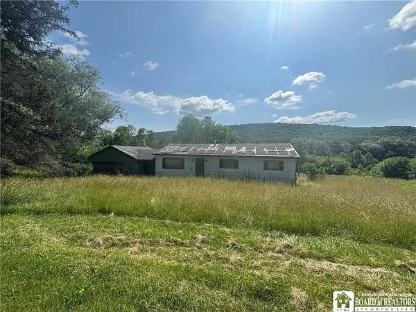 25-Acre Ranch Home with Hardwood Floors and Creek Access