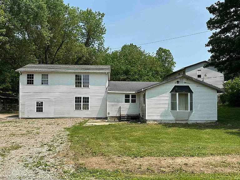 Spacious Rural Home with Potential on Private Acreage