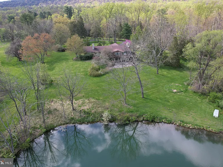 Luxurious Stone Ranch on 180+ Private Acres with Scenic Pond