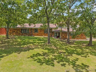 Spacious Multi-Level Home Surrounded by Nature in Peaceful Sand Springs
