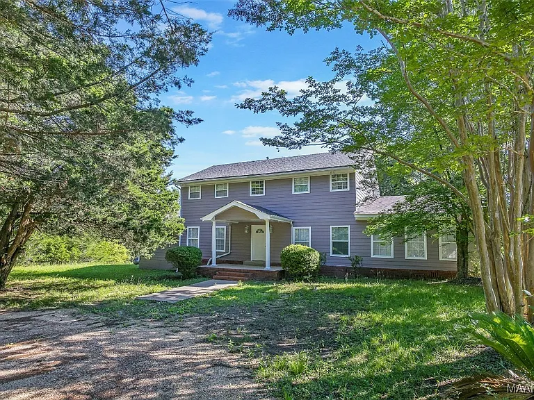 Peaceful Country Retreat with Spacious Home and Scenic Acreage in Hope Hull