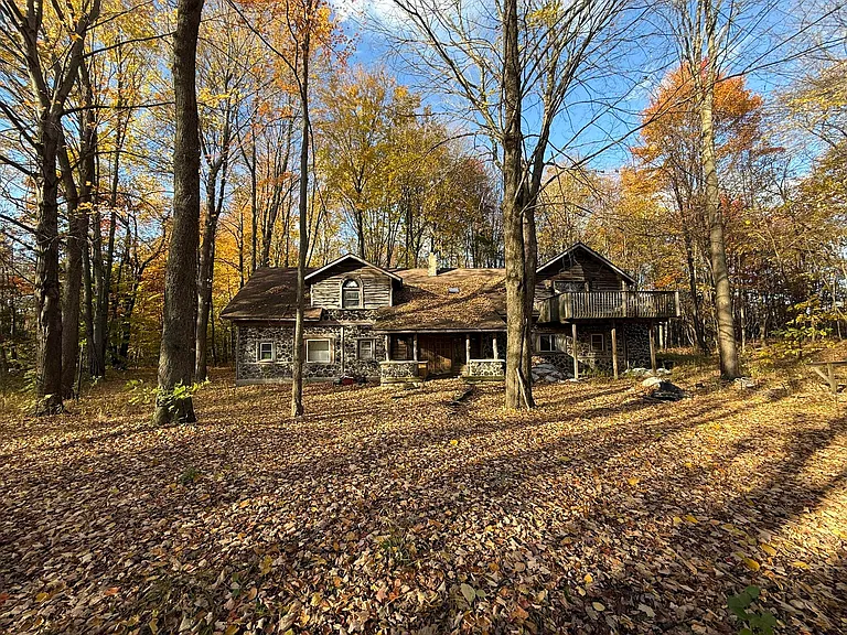Rustic Log Home Retreat with Spacious Acreage in Bangor, Michigan