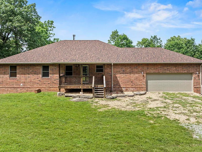 Custom Brick Home on 275‑Acre Lakefront Estate with Shop and Recreational Land