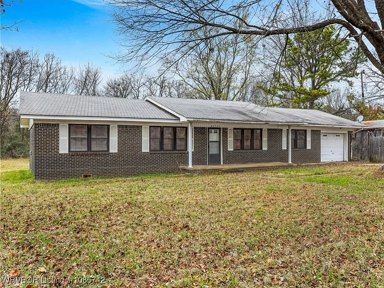 A Comfortable Brick Home in Huntington, Arkansas with Space, Privacy, and Outdoor Potential