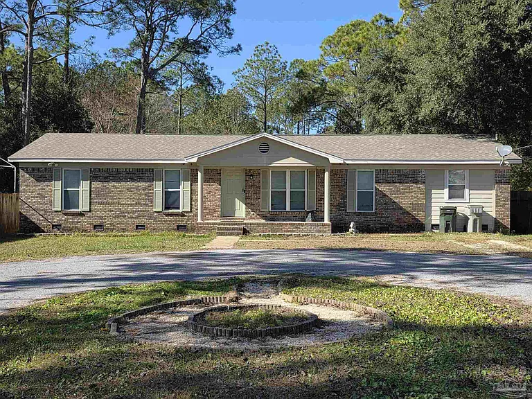 A Spacious Fixer-Upper Opportunity with Endless Potential in a Quiet Pensacola Setting