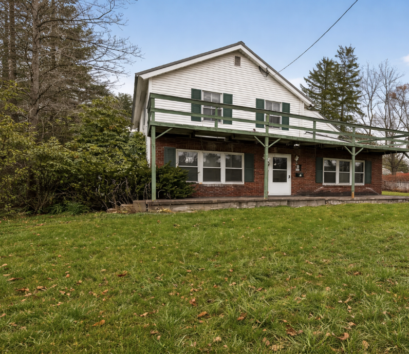 Charming Two-Story Home with Spacious Yard and Renovation Potential in a Quiet Small-Town Setting