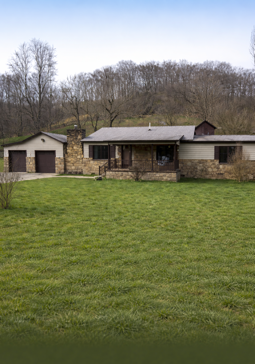 Charming Ranch-Style Home with Stone Accents and Peaceful Outdoor Space