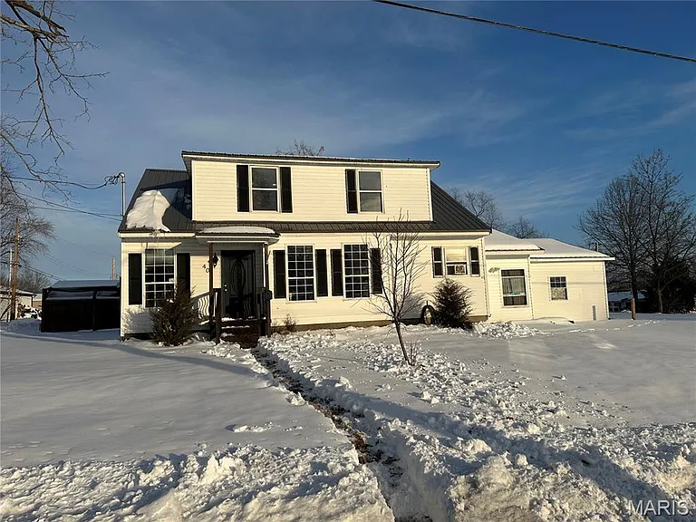 Charming Home with Spacious Living and Great Renovation Potential in Sparta