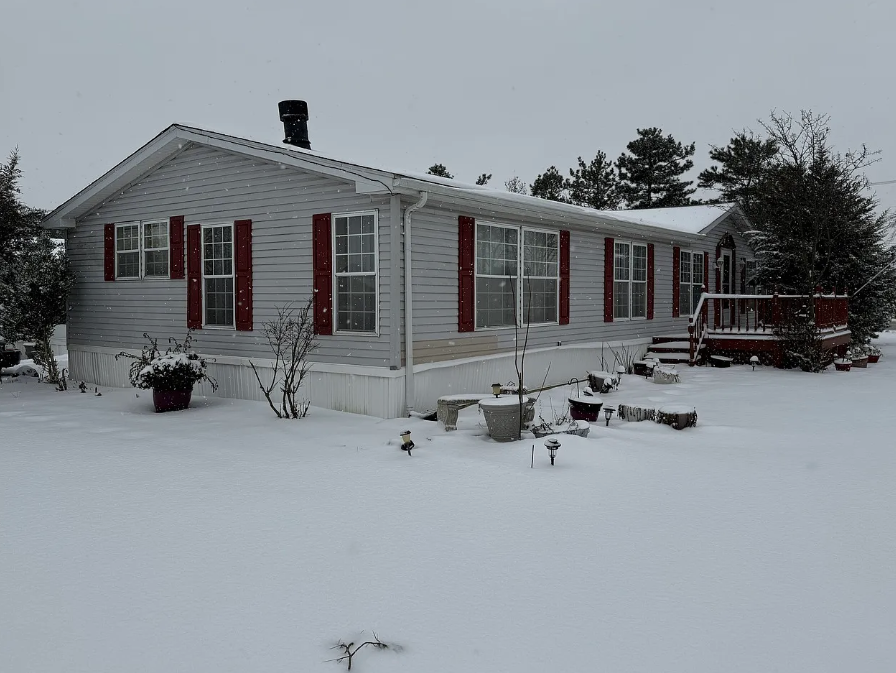 Spacious Three-Bedroom Manufactured Home with Fireplace and Private Outdoor Living in Beecher