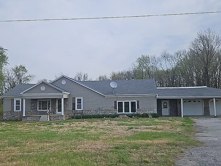 Versatile McLeansboro Property with Land, Garage Space and Income Potential
