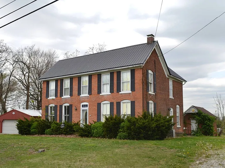 Brick Home with Barn, Garage, and Peaceful Land in Albion