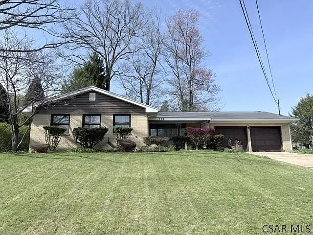 Charming Brick Ranch with Fireplace, Covered Porch and Beautiful Yard in Johnstown