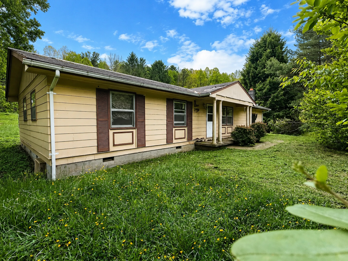 Center Point Country Property with Land, Barn, and Restoration Potential